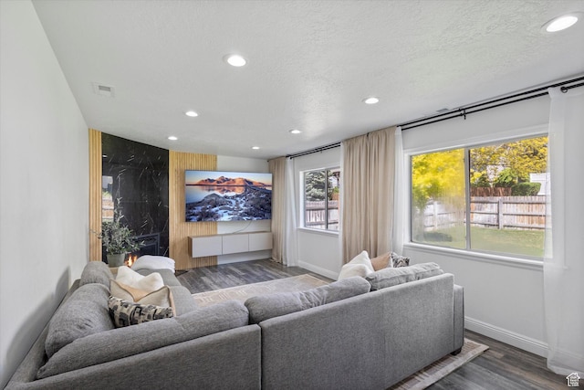 4962 S Glasmann Way S, Ogden, UT 84403 - living room featuring wood finished floors, recessed lighting, baseboards, plenty of natural light, and a textured ceiling