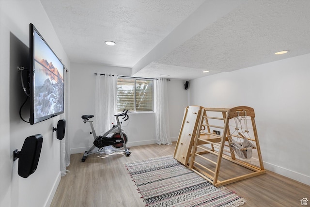 4962 S Glasmann Way S, Ogden, UT 84403 - exercise room with a textured ceiling, baseboards, wood finished floors, and recessed lighting
