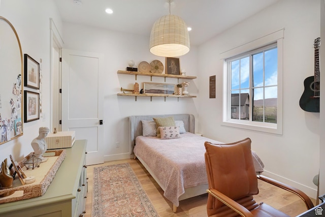 bedroom featuring light wood-style flooring, recessed lighting, and baseboards