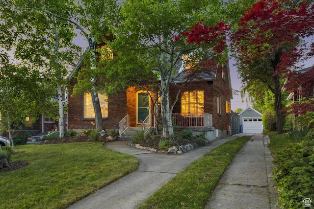 1225 E 700 S, Salt Lake City, UT 84102 - view of front of property featuring an outdoor structure, concrete driveway, a front lawn, a garage, and covered porch
