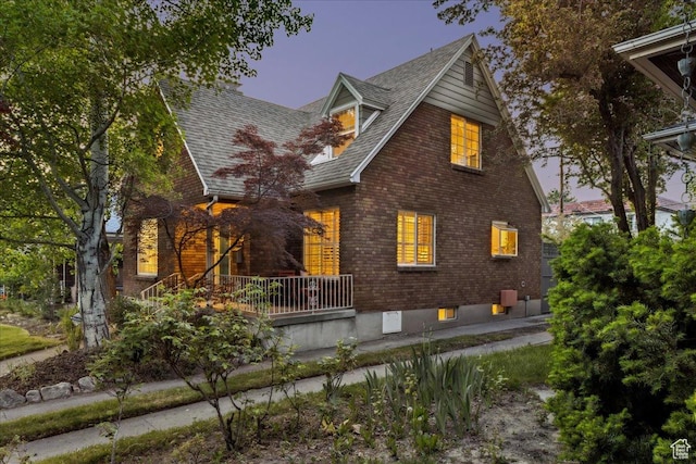 1225 E 700 S, Salt Lake City, UT 84102 - view of front of home featuring brick siding, roof with shingles, and covered porch