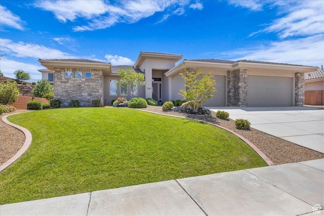 prairie-style home with stone siding, a garage, driveway, a tile roof, and stucco siding