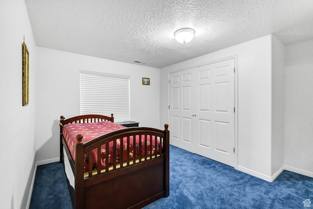 860 S 720 W, Glenwood, UT 84730 - bedroom with carpet, baseboards, a textured ceiling, and a closet