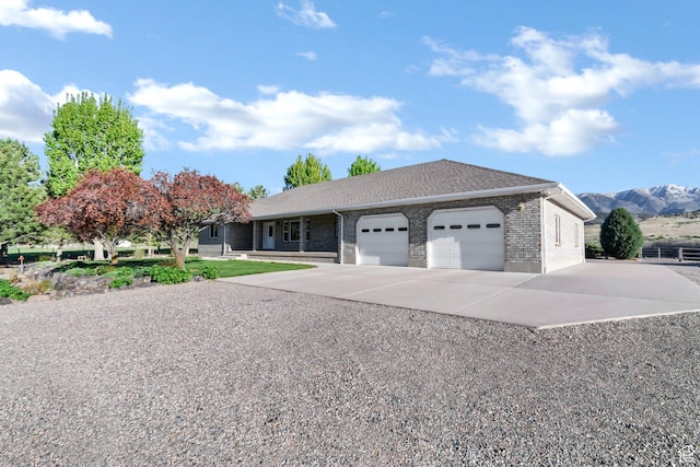 860 S 720 W, Glenwood, UT 84730 - ranch-style house featuring a garage, driveway, brick siding, and a mountain view