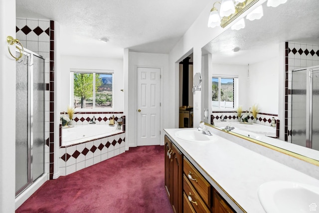 860 S 720 W, Glenwood, UT 84730 - full bathroom featuring plenty of natural light, a shower stall, a textured ceiling, a garden tub, and double vanity