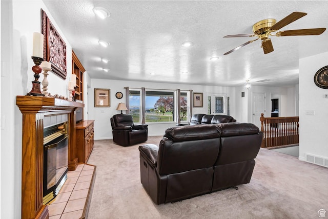 860 S 720 W, Glenwood, UT 84730 - living area featuring a fireplace, light colored carpet, a textured ceiling, ceiling fan, and baseboards