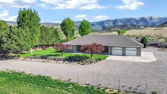 860 S 720 W, Glenwood, UT 84730 - view of side of property featuring a garage, concrete driveway, and a mountain view