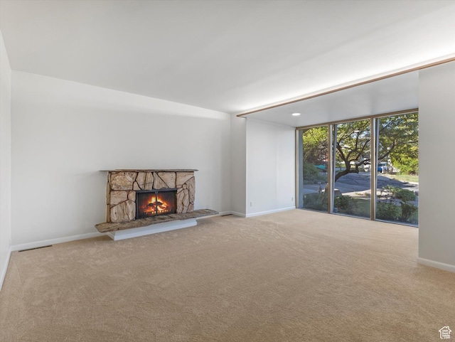 331 N K St, Salt Lake City, UT 84103 - unfurnished living room with carpet flooring, a fireplace, and baseboards