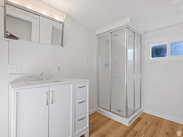331 N K St, Salt Lake City, UT 84103 - full bath with a stall shower, wood finished floors, vanity, and baseboards