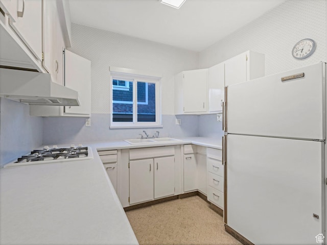 331 N K St, Salt Lake City, UT 84103 - kitchen with white appliances, a sink, light countertops, and white cabinets