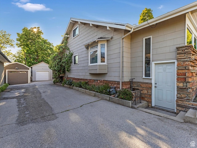 331 N K St, Salt Lake City, UT 84103 - view of property exterior featuring a garage and an outbuilding