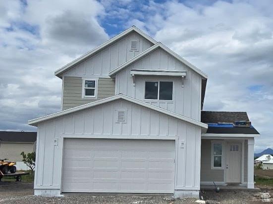 208 W 1300 S, Tremonton, UT 84337 - view of front of house featuring an attached garage and board and batten siding
