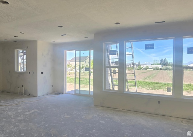 unfurnished room featuring recessed lighting