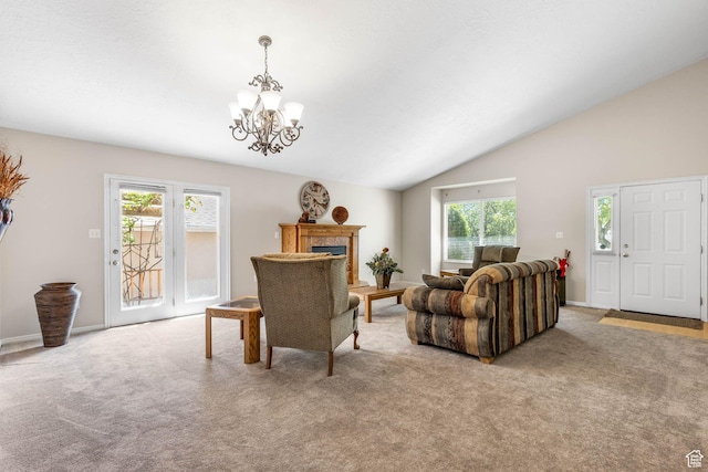 1660 E 900 S Unit 29, Clearfield, UT 84015 - carpeted living room featuring a chandelier, a fireplace, lofted ceiling, and baseboards