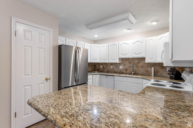 1660 E 900 S Unit 29, Clearfield, UT 84015 - kitchen featuring white appliances, a sink, white cabinets, a textured ceiling, and backsplash