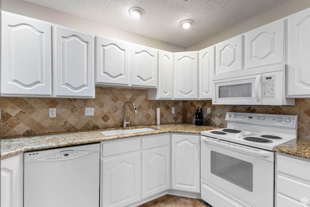 1660 E 900 S Unit 29, Clearfield, UT 84015 - kitchen with white appliances, a sink, white cabinetry, backsplash, and a textured ceiling