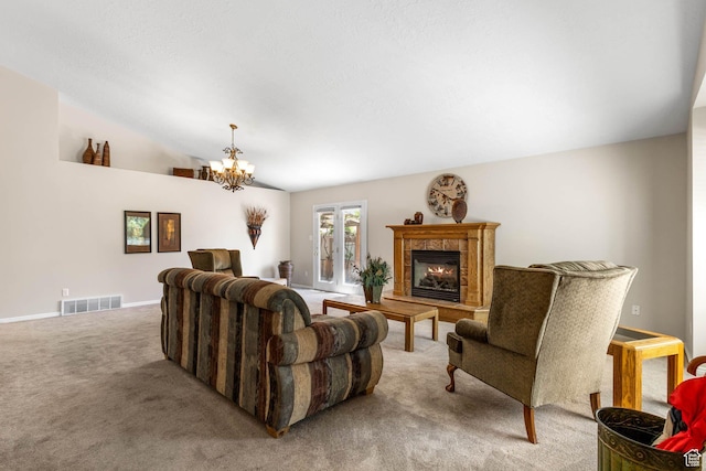 1660 E 900 S Unit 29, Clearfield, UT 84015 - living room with carpet flooring, a chandelier, a tiled fireplace, vaulted ceiling, and baseboards