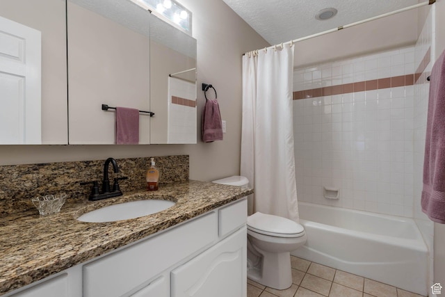 1660 E 900 S Unit 29, Clearfield, UT 84015 - full bath featuring tile patterned flooring, toilet, shower / tub combo with curtain, vanity, and a textured ceiling