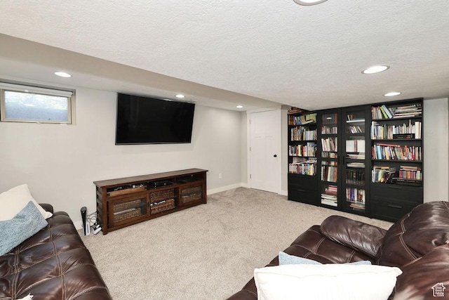 carpeted living area with a textured ceiling, recessed lighting, and baseboards