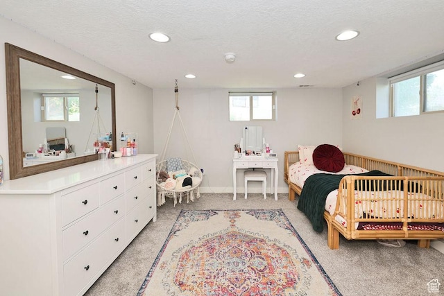 bedroom with recessed lighting, light colored carpet, multiple windows, and baseboards