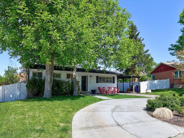 ranch-style home with concrete driveway and a gate