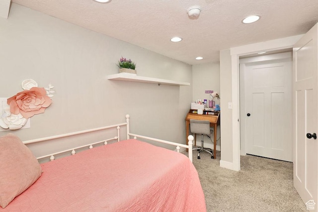 bedroom featuring recessed lighting, carpet floors, baseboards, and a textured ceiling