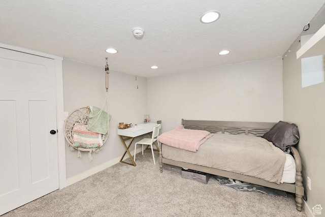 carpeted bedroom with recessed lighting and baseboards