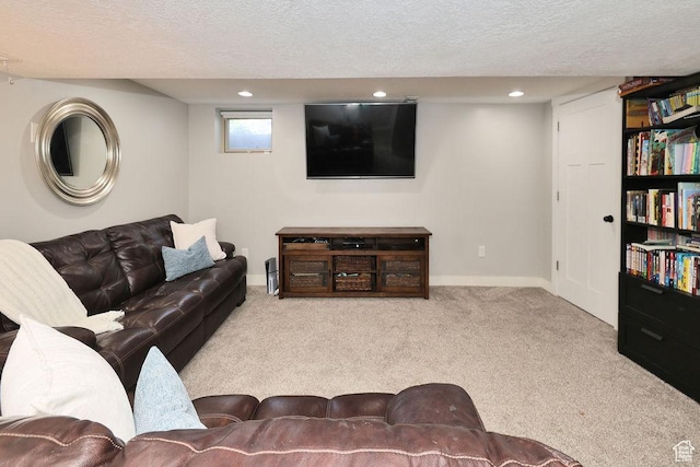 carpeted living room featuring a textured ceiling, recessed lighting, and baseboards