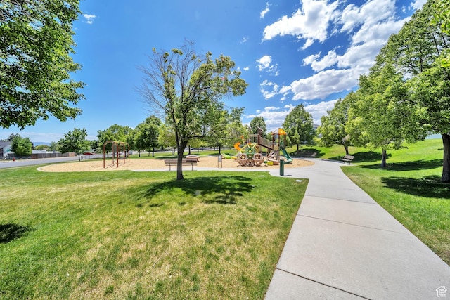 view of property's community with a lawn