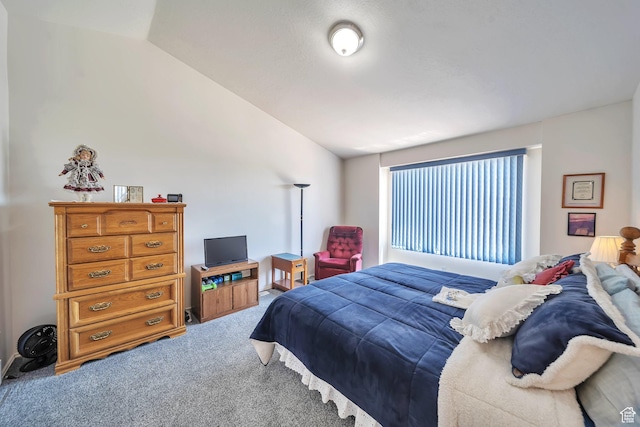 carpeted bedroom featuring vaulted ceiling