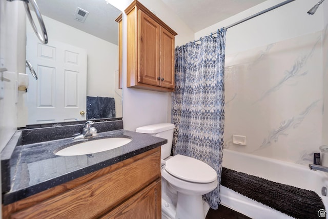 bathroom with toilet, vanity, and shower / tub combo