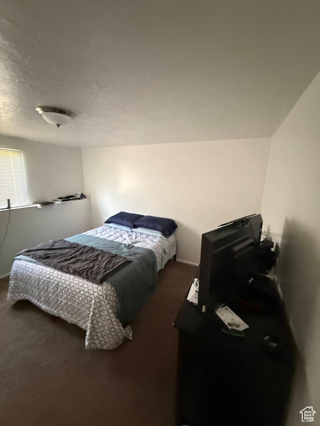 bedroom with carpet and baseboards