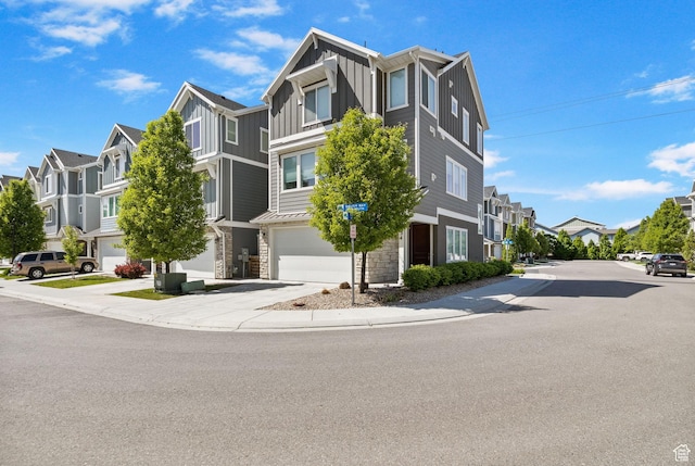 834 W Shelton Way, Midvale, UT 84047 - view of property featuring a residential view, an attached garage, and driveway