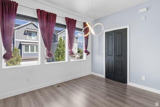 834 W Shelton Way, Midvale, UT 84047 - empty room with wood finished floors and baseboards