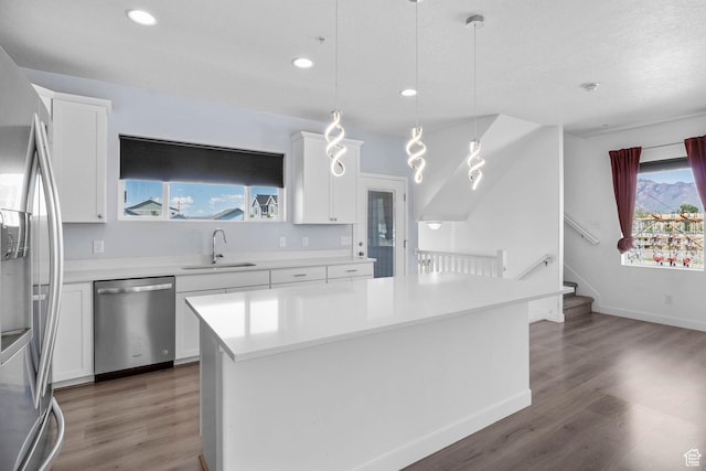 834 W Shelton Way, Midvale, UT 84047 - kitchen with appliances with stainless steel finishes, a sink, wood finished floors, white cabinets, and recessed lighting