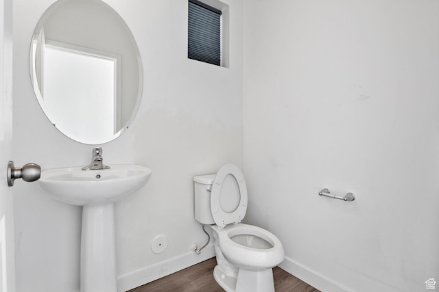 834 W Shelton Way, Midvale, UT 84047 - half bathroom featuring toilet, baseboards, and wood finished floors