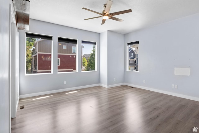 834 W Shelton Way, Midvale, UT 84047 - unfurnished room featuring ceiling fan, wood finished floors, and baseboards