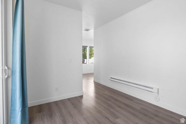 834 W Shelton Way, Midvale, UT 84047 - spare room featuring baseboard heating, wood finished floors, and baseboards