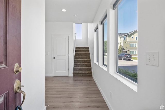 834 W Shelton Way, Midvale, UT 84047 - corridor with plenty of natural light, wood finished floors, stairs, baseboards, and recessed lighting