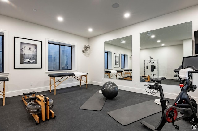 exercise area with recessed lighting and baseboards