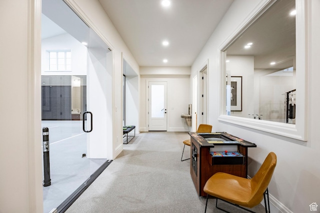 hall with carpet floors, recessed lighting, and baseboards
