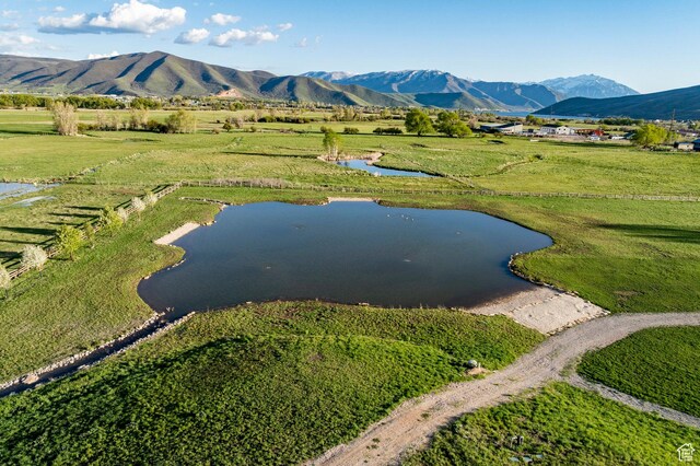 view of rural area with a water and mountain view