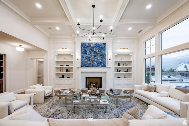 618 S Fox Den Rd Unit 2, Midway, UT 84049 - living room featuring built in features, coffered ceiling, ornamental molding, beamed ceiling, and a chandelier