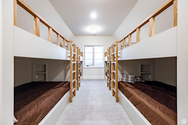 carpeted bedroom featuring baseboards