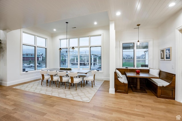 dining room featuring baseboards, light wood-style flooring, plenty of natural light, recessed lighting, and wooden ceiling