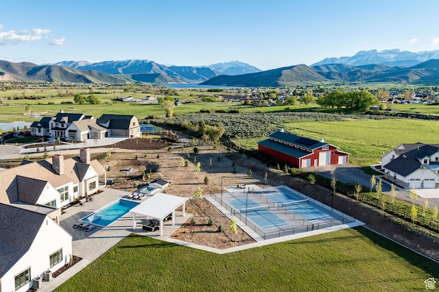 overview of rural landscape with mountains and a pool