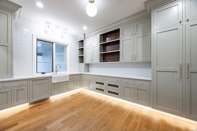 618 S Fox Den Rd Unit 2, Midway, UT 84049 - kitchen featuring a sink, gray cabinetry, open shelves, and light wood-style flooring