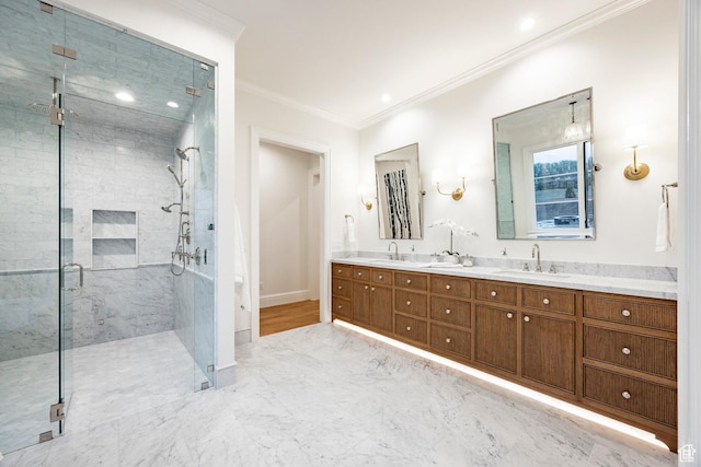bathroom featuring ornamental molding, a stall shower, double vanity, baseboards, and marble look tiles