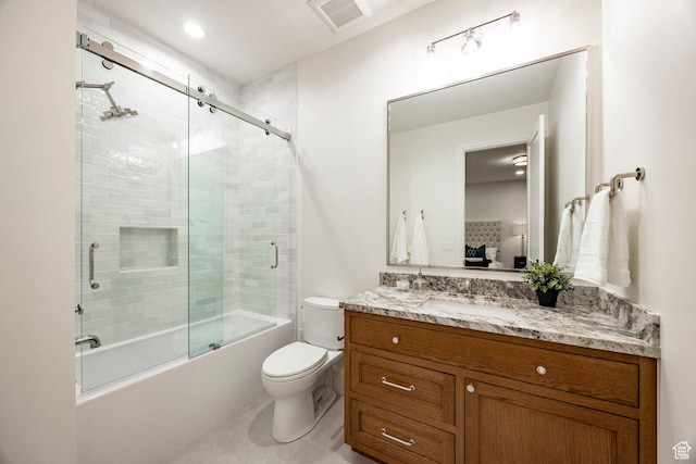 full bath with toilet, vanity, enclosed tub / shower combo, and tile patterned floors