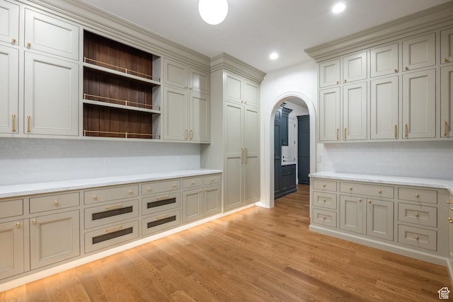 618 S Fox Den Rd Unit 2, Midway, UT 84049 - kitchen featuring arched walkways, light countertops, light wood finished floors, open shelves, and recessed lighting